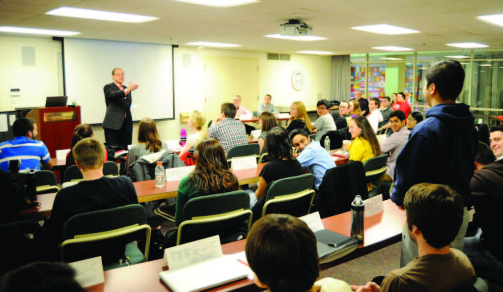 President Joseph E. Aoun speaks at an SGA meeting in 2012. 