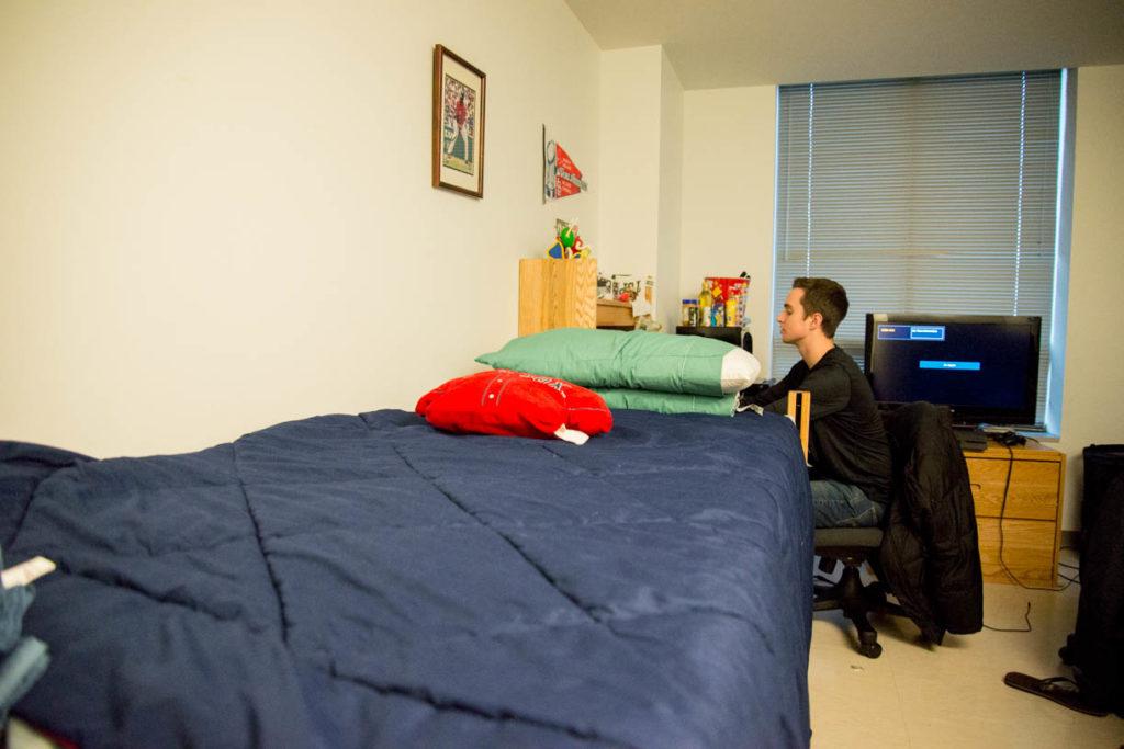 Freshman journalism major PJ Wright sits at his desk in his dorm in East Village. Wright spent his first semester in the NU.in program in London. 