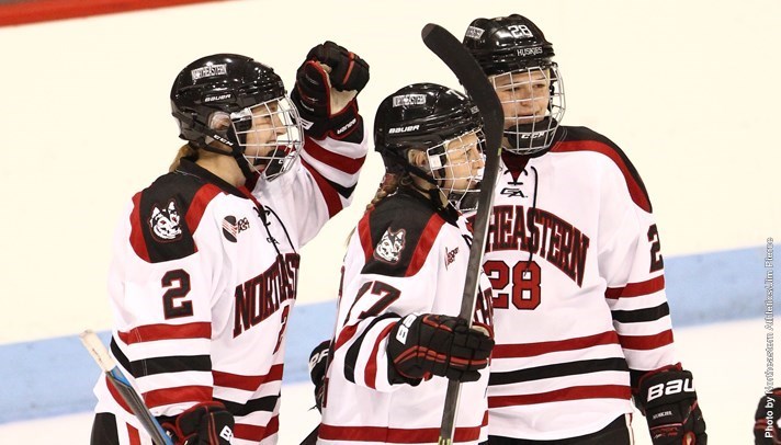 Junior forwards Kendall Coyne and Paige Savage and freshman defender Lauren Kelly celebrate after a goal against UConn on Jan. 3.