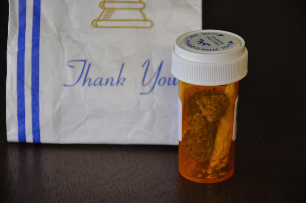 The+licensure+process+required+by+Massachusetts+medical+marijuana+dispensaries+is+facing+imminent+reform.+Pictured%3A+a+prescription+pill+bottle+filled+with+cannabis.