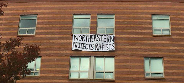 Student+removes+banner+criticizing+NUs+handling+of+sexual+assaults