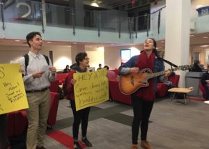 Students sing to advocate for higher wages for dining hall workers