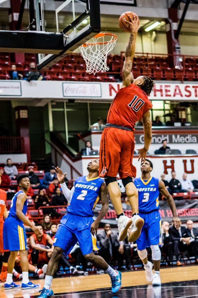 T.J. Williams goes up for a shot in a game against Hofstra this season. / Photo by Lauren Scornavacca