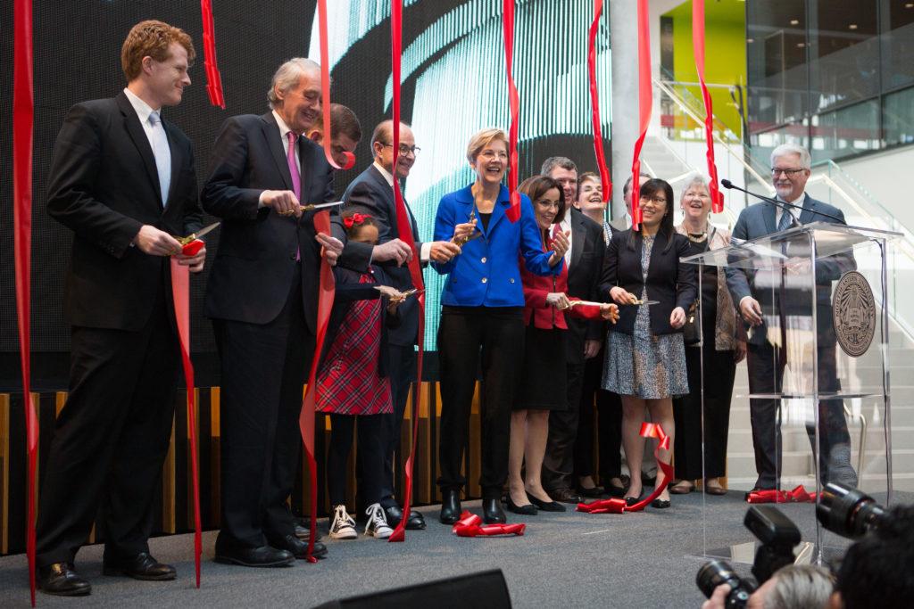 Sen. Elizabeth Warren and President Joseph E. Aoun cut red ribbons in a symbolic ceremony to celebrate the opening of the ISEC in 2017. 