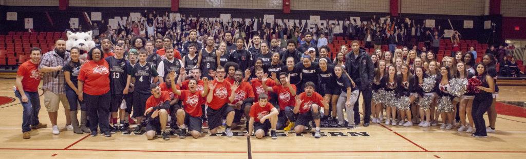 Participants+in+the+Special+Spirit+basketball+game+pose+with+members+of+the+Northeastern+mens+basketball+team+%2F+Photo+by+Jon+Polen