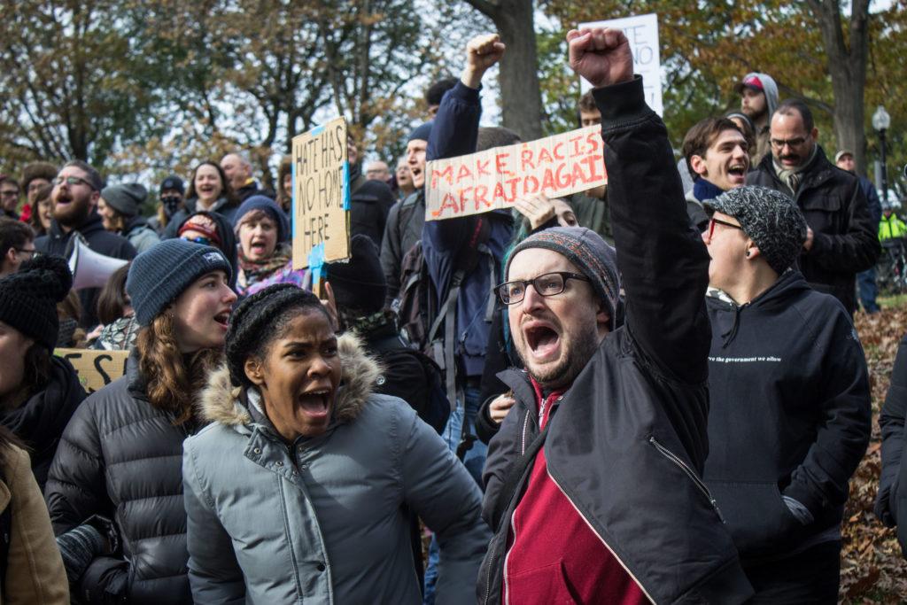 Free speech rally draws dozens, leads to three arrests