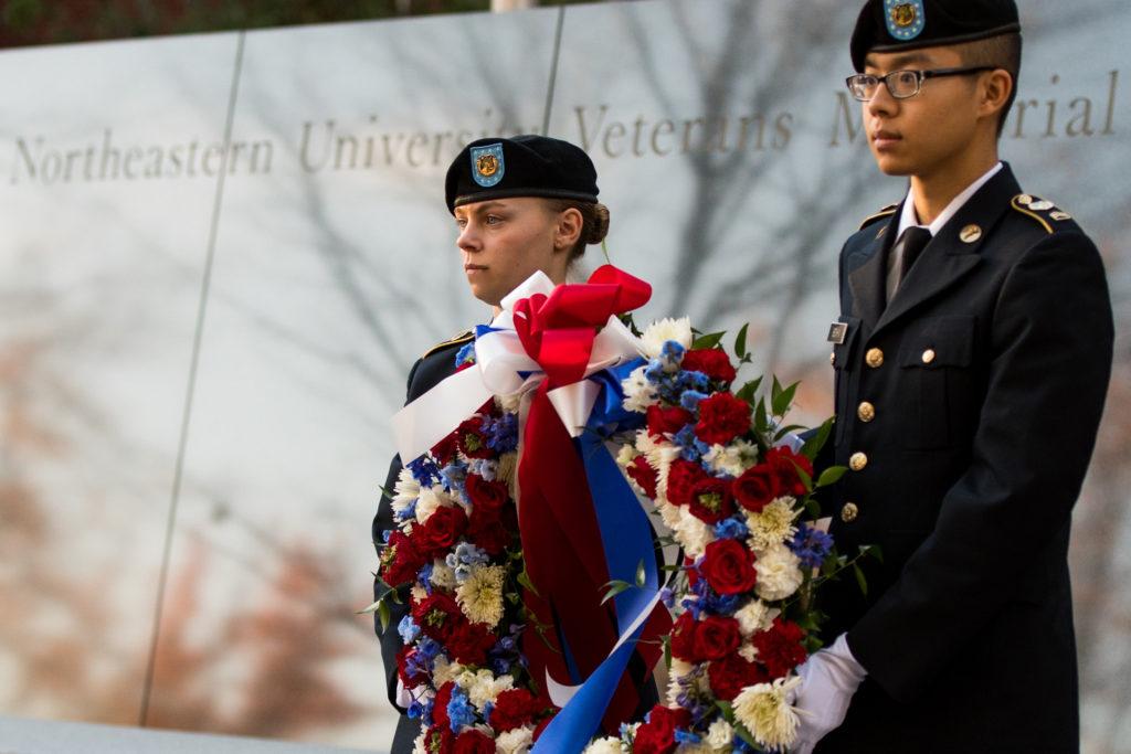 ROTC cadets Aleksandra Pirog, a fourth-year mechanical engineering major, and 
Hyungseup Brent Schin, a third-year international affairs major, lay a wreath on the Veterans Memorial in honor of those who have served./ Photo by Brain Bae