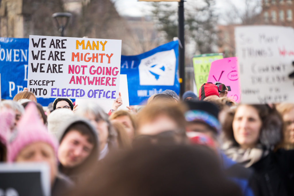 Signs+at+the+Womens+March+in+Cambridge.+This+sign+reads%2C+%E2%80%9CWe+are+many%2C+we+are+might%2C+we+are+not+going+anywhere%2C+except+into+elected+office.%E2%80%9D+%2F+Photo+by+Alex+Melagrano.