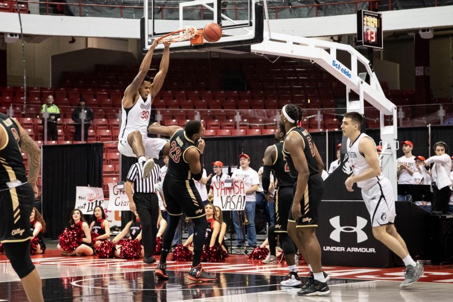 Senior center Anthony Green throws down a dunk in a prior game against Charleston.