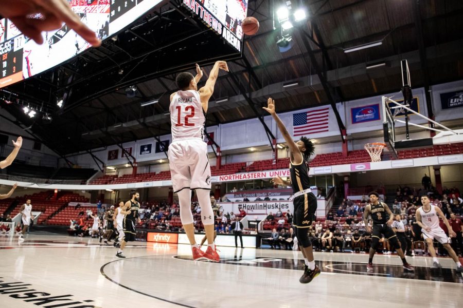 Junior guard Jordan Roland shoots a 3-pointer during a prior game against Charleston.