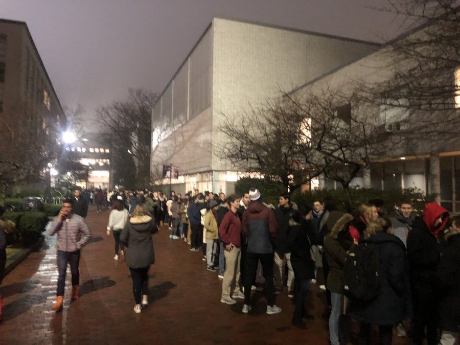 Dozens+of+students+wait+in+line+to+enter+the+Cabot+Center+and+take+part+in+the+winter+involvement+fair.