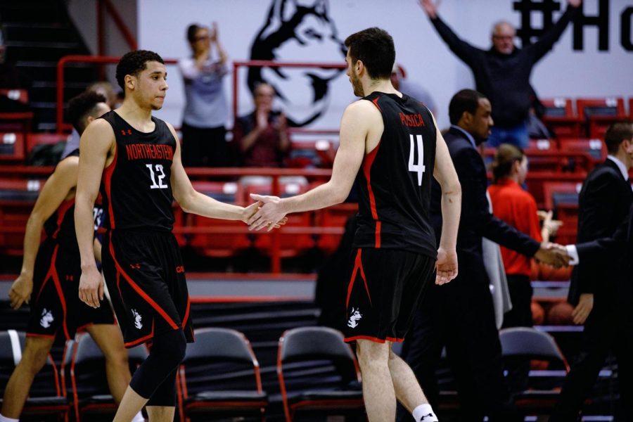 Senior guard Vasa Pusica walks off the court Thursday night. He led the Huskies with 19 points.