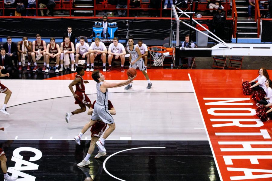 Junior guard Bolden Brace goes airborne on his drive to the basket against Elon Saturday. He finished the night with 20 points and 14 rebounds.