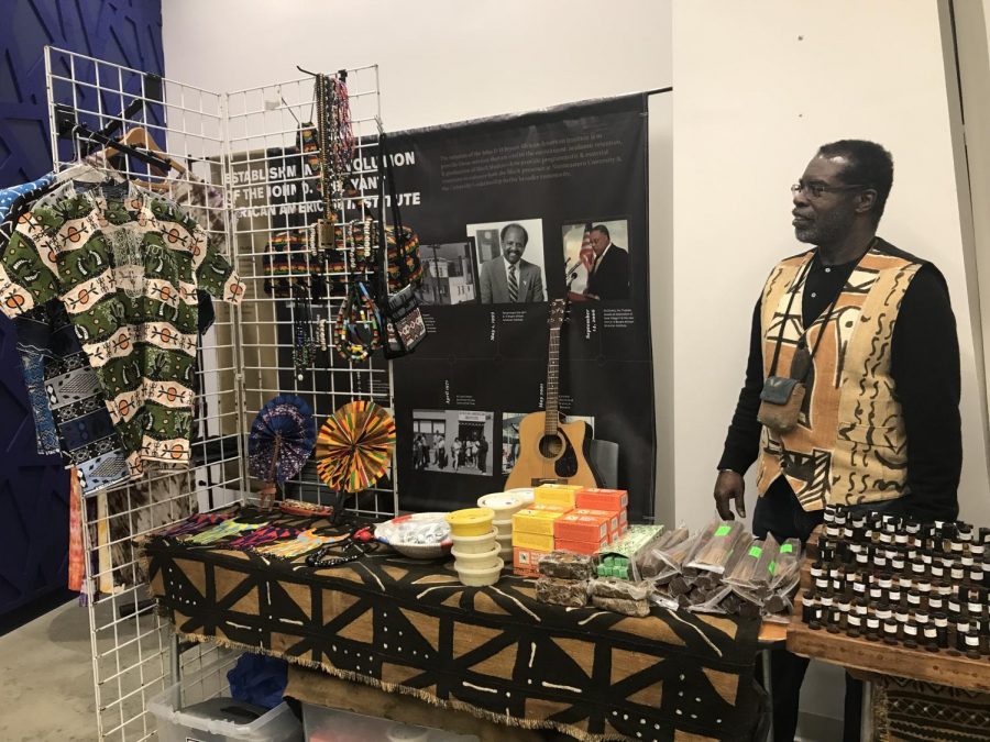 Rickie+Thompson%2C+co-founder+of+Prime+Taste+of+Africa%2C+sells+his+Afrocentric+merchandise+at+the+NU+Black+Market+event.