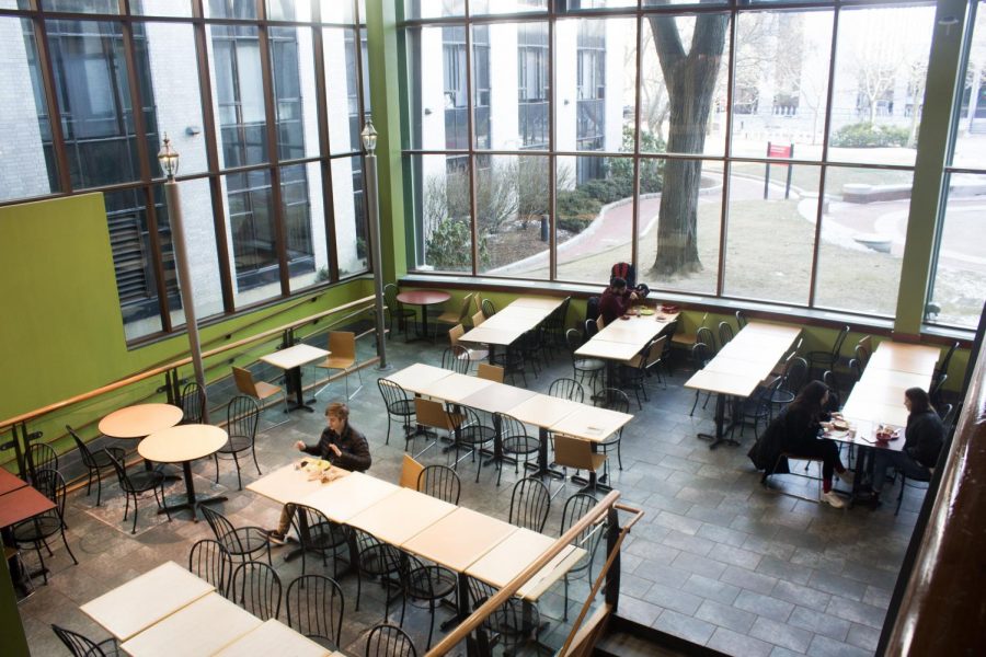 A few students lounge in a corner of one of Northeasterns increasingly expensive dining halls.