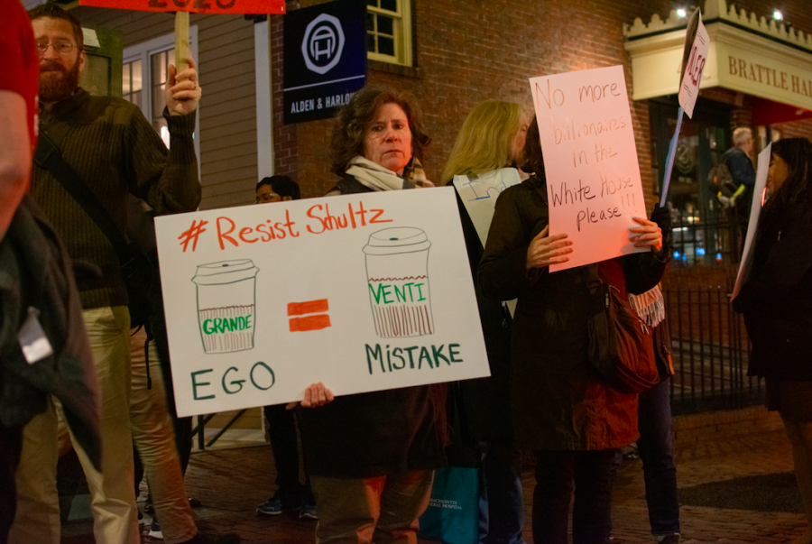 Protesters gathered outside the Brattle Theatre in Cambridge Tuesday to protest Howard Schultzs potential presidential run. Among them was Maria Robinson of Cambridge, pictured above. 