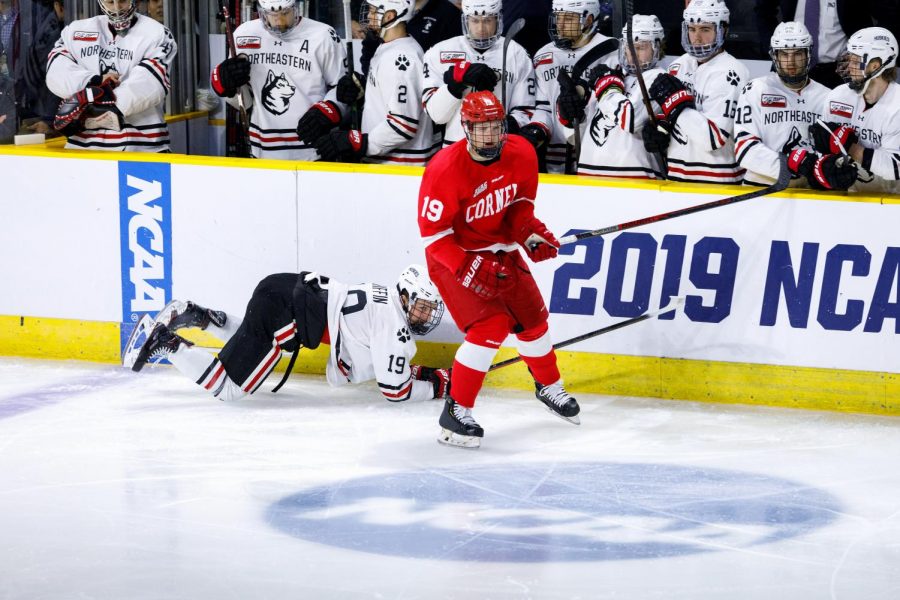 Lincoln Griffin loses his footing in front of the NU bench Saturday as the Huskies lost, 5-1 to Cornell in the NCAA Tournament.