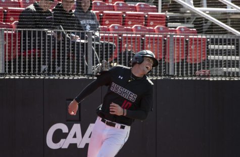 Redshirt freshman Corey DiLoreto celebrates after scoring a run in a March 16 game against Holy Cross.
