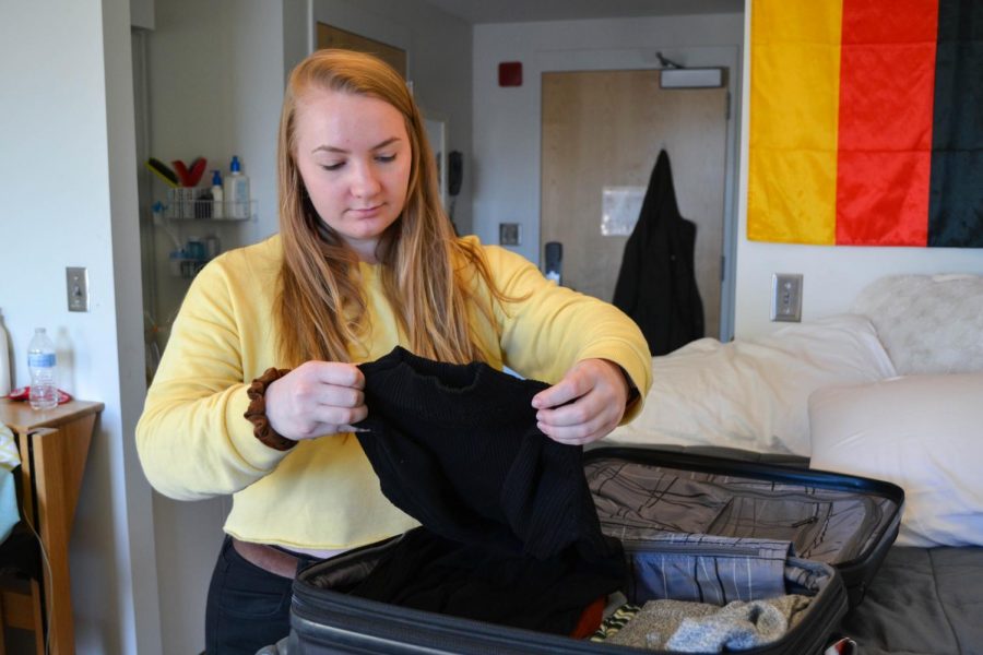 Reine Lederer packs for her summer trip to Spain in her International Village dorm room. She spent last semester in Germany with the N.U.in program.