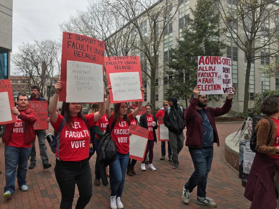 Student protesters with t-shirts and signs stating “Let Faculty Vote” held a sit-in at the Visitor Center April 18. 