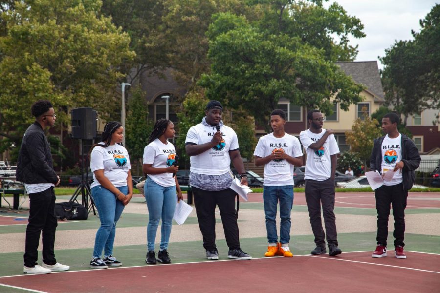 Organizers for the R.I.S.E. Rally against community gun violence gathered with Boston residents in Roxbury Saturday.  