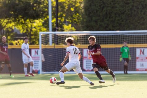 Sophomore midfielder Jacob Marin-Thomson sidesteps a defender in a game against Charleston College. 