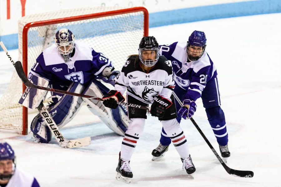 Senior forward Matti Hartman positions herself in front of the net in a game against Holy Cross last year.