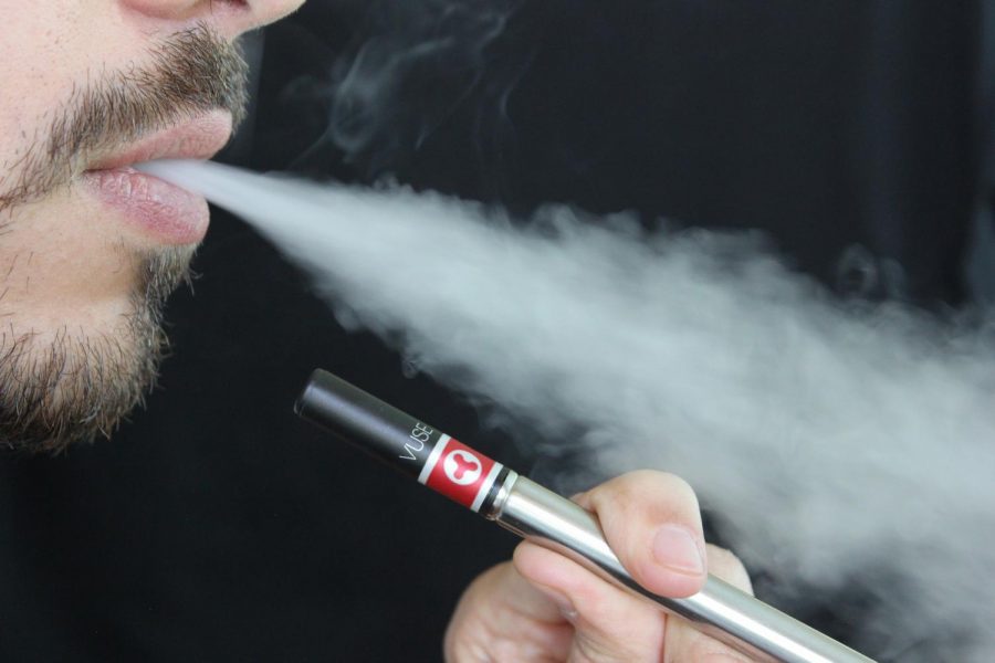 Vaping, popular at Northeastern and at colleges around the country, has been banned in Massachusetts, leading to mixed reactions.