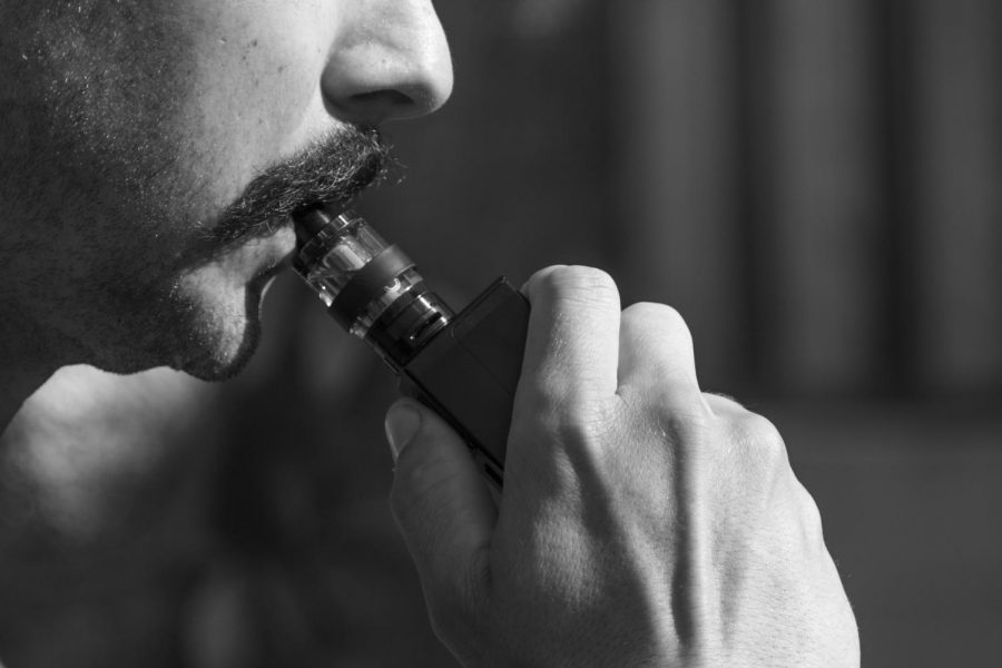 Vaping, popular at Northeastern and at colleges around the country, has been banned in Massachusetts, leading to mixed reactions.