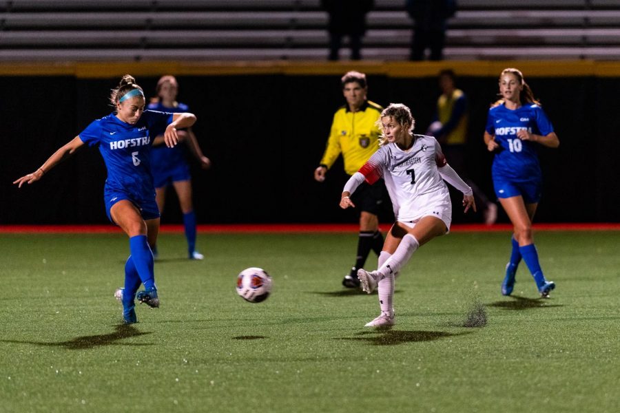 Senior midfielder Emily Evangelista lines up a pass in a game against Hofstra earlier this season.