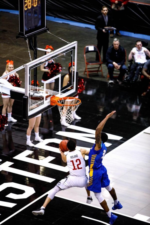 Senior guard Jordan Roland, who now holds the mens basketball single-game points record, goes for a layup in a game last season against Hofstra.