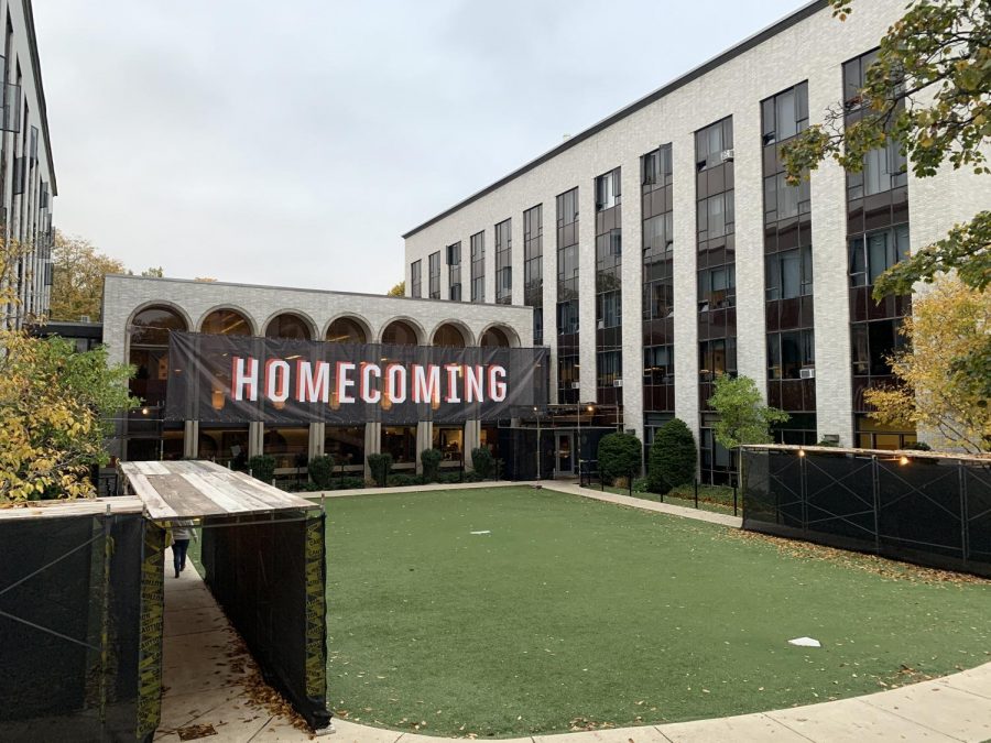 A Homecoming banner hangs on the side of Speare Hall.