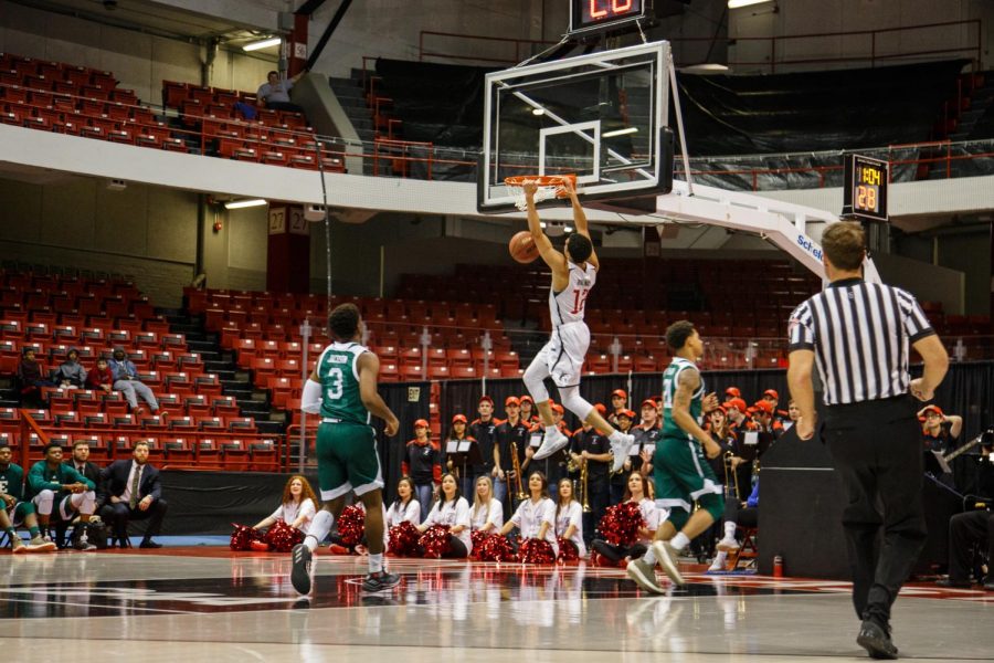 Senior guard Jordan Roland goes up for a dunk in a game last season versus Eastern Michigan.