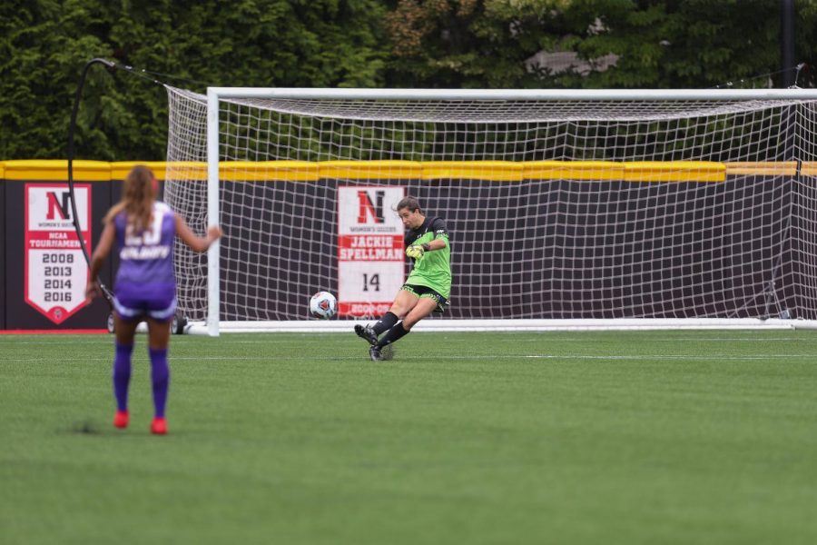 Women's soccer goalkeeper Megan Adams kicks the ball away from her goal in a game earlier this season. 
