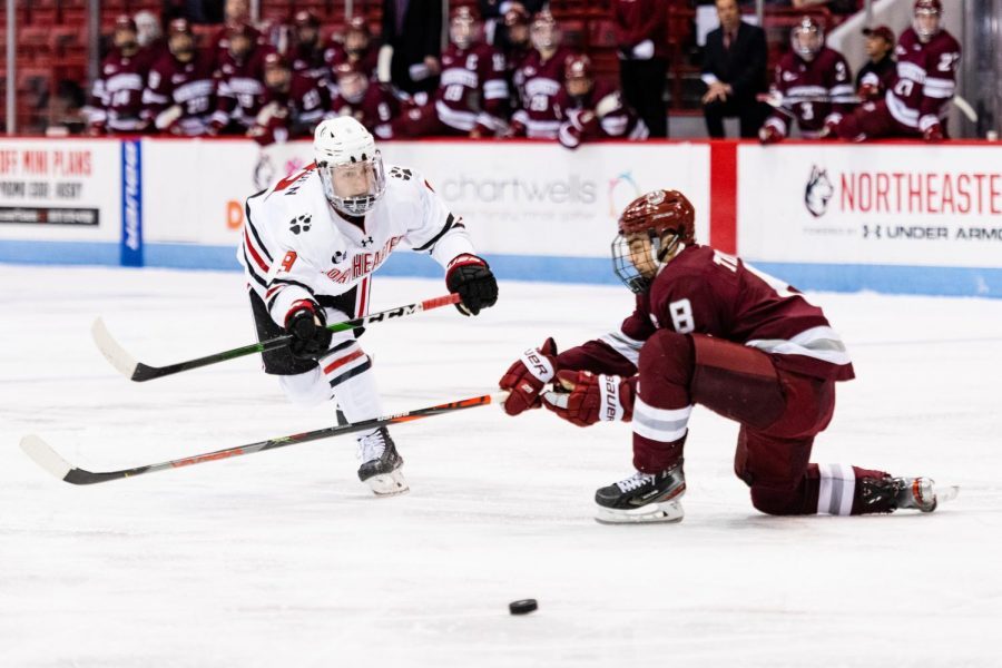 NU+sophomore+center+Tyler+Madden+%289%29+shoots+the+puck+during+NUs+home+opener+against+UMass+on+Oct.+15.