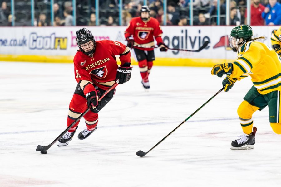 Sophomore forward Mia Brown handles the puck against Clarkson in last seasons matchup in Belfast. 