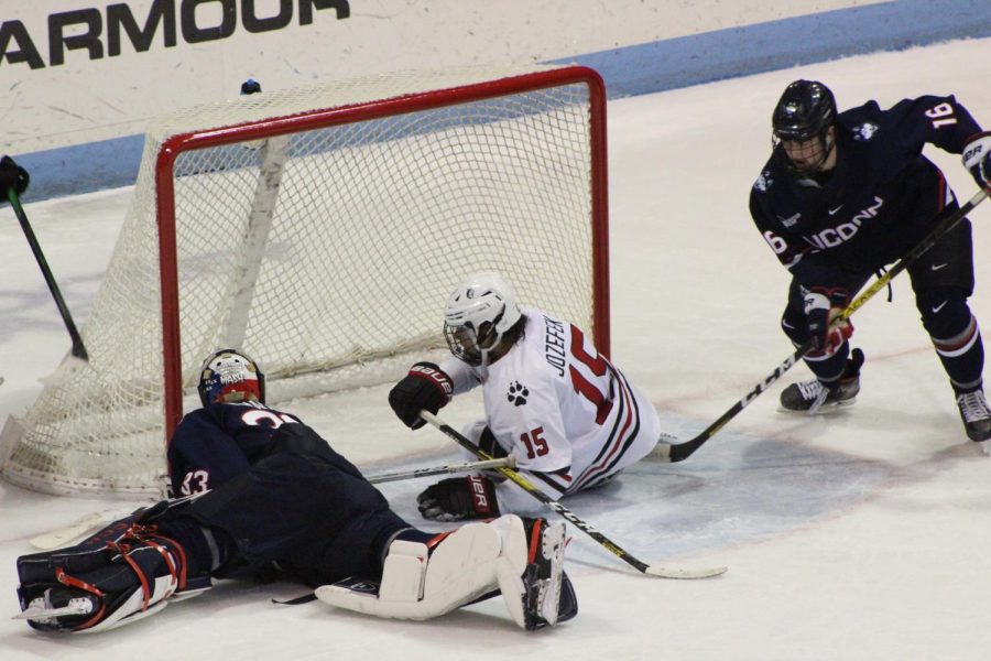 Senior forward Grant Jozefek looks on as UConn goalie Tomas Vomacka shuts down his attempt to score. 