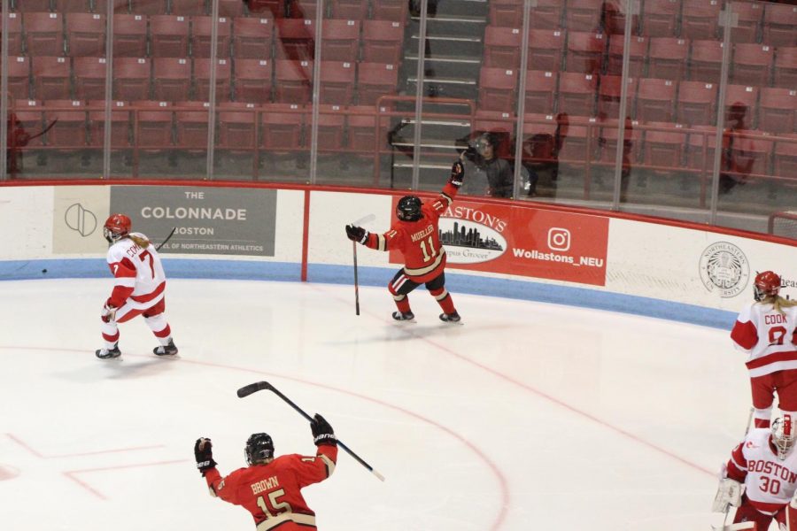 Mueller celebrates her game-tying tally. Mia Brown, who assisted on the goal, joins her. 