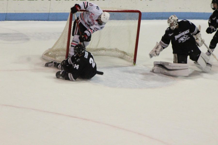 Demelis (and the puck) fly into the net for NUs second goal of the night. 