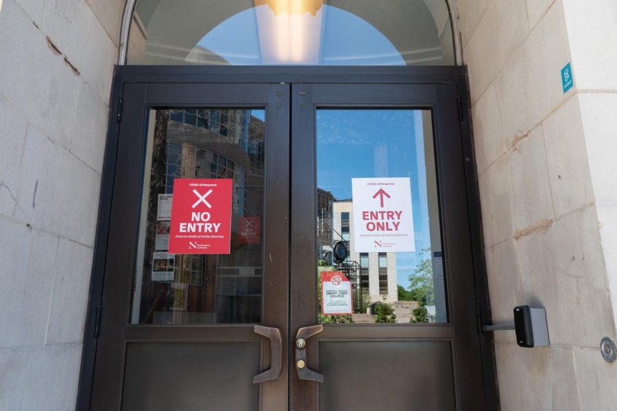 Signs regulating one-way traffic have been affixed to most doors throughout campus.