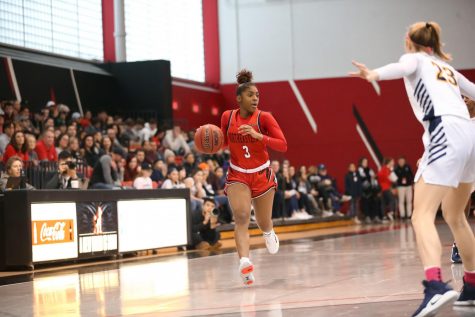 Sophomore guard Mossi Staples surveys the court as she nears the 3-point line in a game against Drexel last season.