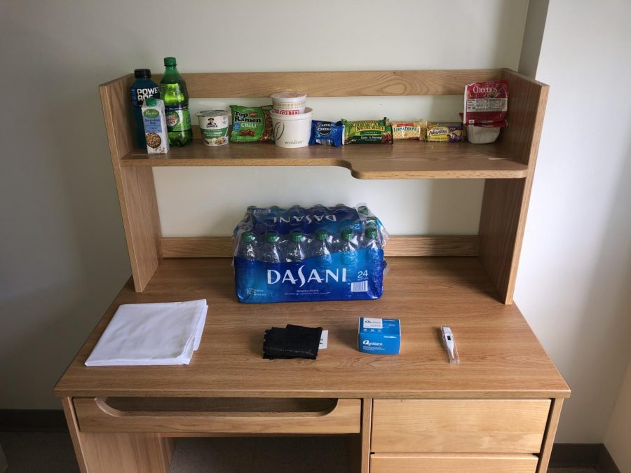 Hannah Kellys desk in International Village with some of the supplies she was given for quarantine. 
