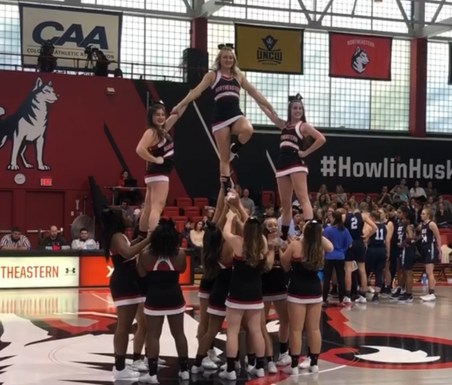 The Northeastern club cheerleading team poses in a pyramid at Cabot Center last year, but currently have to practice over Zoom like many other club sports teams.