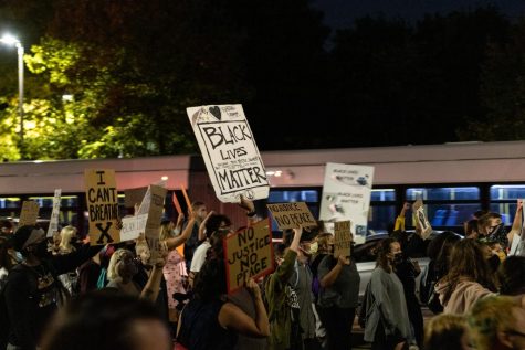 Protestors march through the Boston streets on Friday evening.