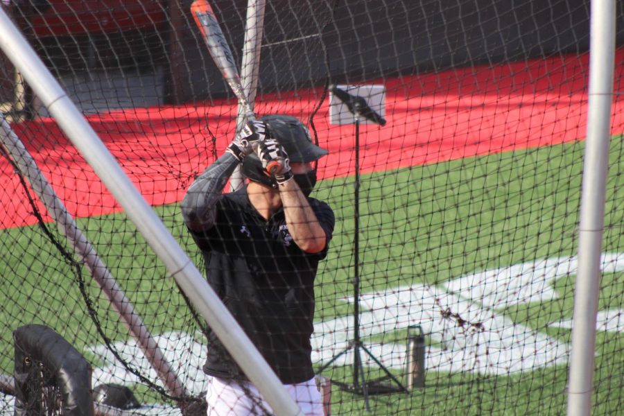 Scott Holzwasser bats at practice Sept. 29 at Parsons Field.