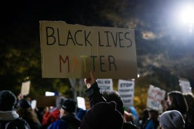 The book 'They Can't Kill Us All' was written after Michael Brown's death in 2016, yet it still reflects events and protests happening in the present. 