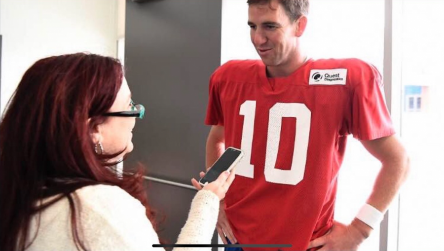 Sports journalist Tara Sullivan interviews Eli Manning, former New York Giants quarterback. 