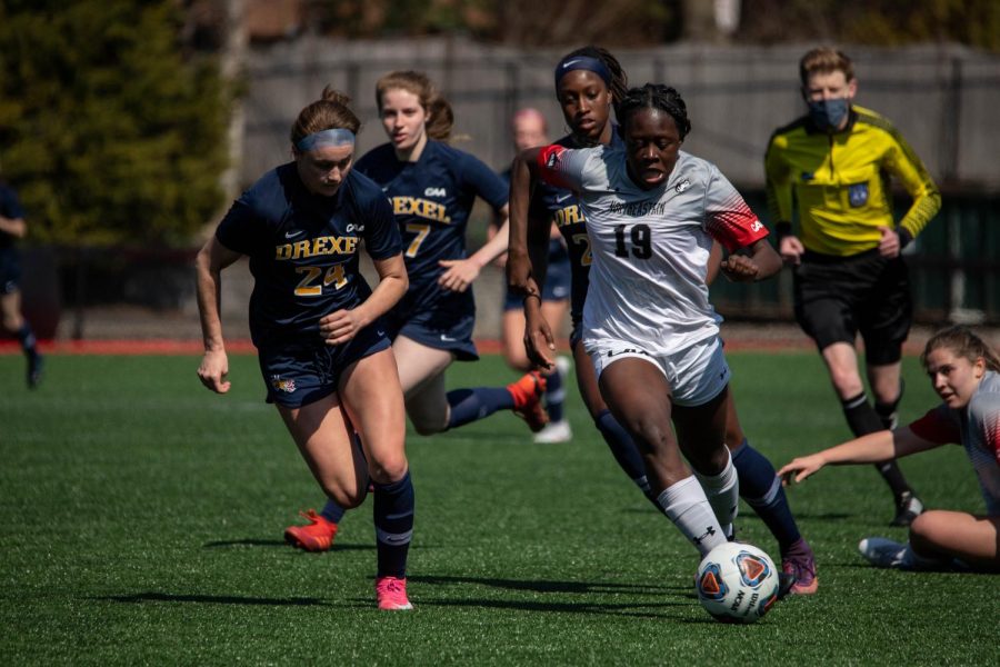 Senior forward Chelsea Domond dribbles past the Drexel Dragons in a game earlier this season.