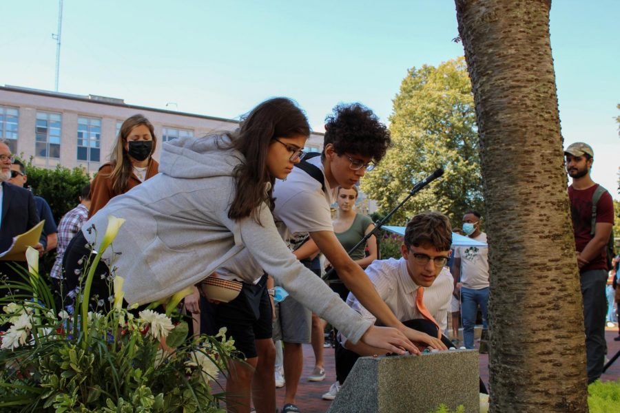 During+the+event+Sept.+11%2C+attendees+placed+roses+and+small+commemorative+stones+on+the+memorial.+The+event+also+featured+several+speakers+and+a+moment+of+silence+for+the+victims+of+9%2F11.+