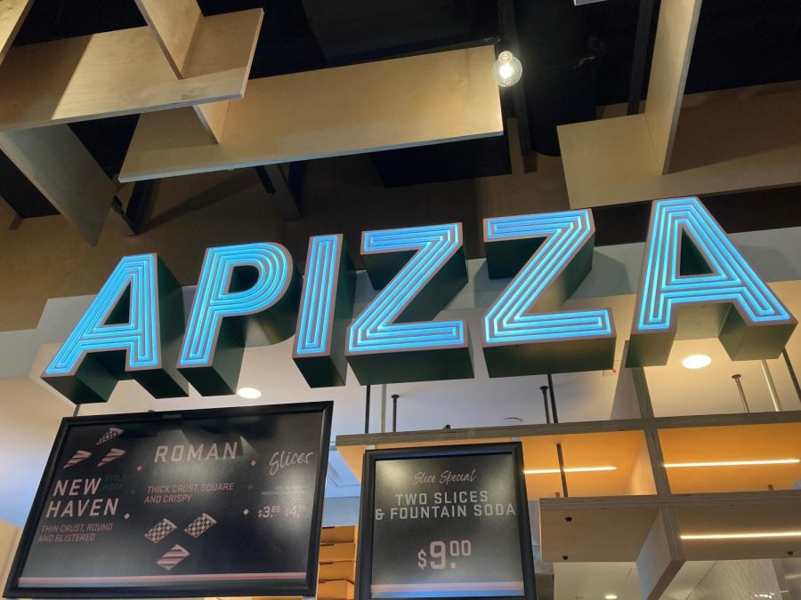 The APIZZA sign hangs in Hub Hall